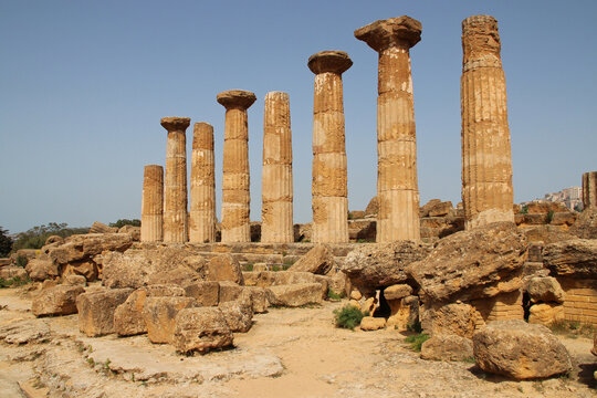 ruined ancient (greco-roman) temple (hercules temple) at the valley of temples in agrigento in sicily in italy