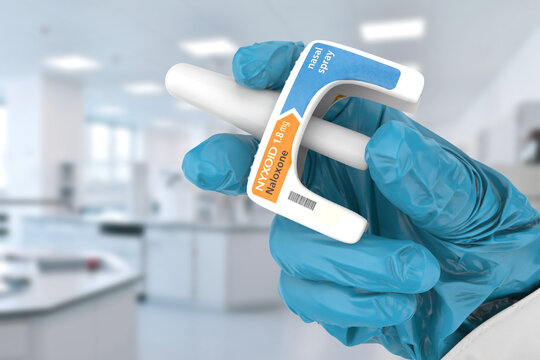 A doctor holds Nyxoid, a naloxone nasal spray used for emergency opioid overdose reversal. This product is used in healthcare, addiction treatment, public health, and pharmaceuticals. Editorial use on