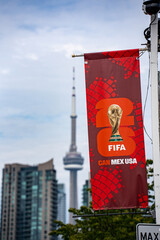 Naklejka premium FIFA World Cup 2026 Toronto banner with CN Tower in background. Toronto, Canada - June 9, 2026.