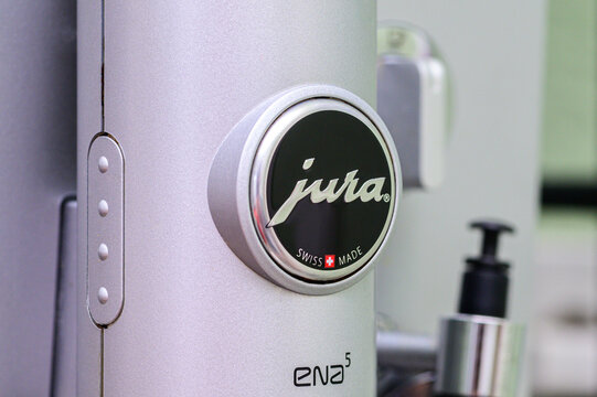 iserlohn, germany &acirc;&euro;&rdquo; june 7 2026: close-up detail of jura ena 5 swiss-made automatic coffee machine with logo and control button visible.
