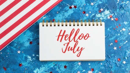 Obraz premium Hello July text on notebook with patriotic stars and stripes background