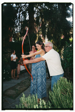 Outdoor Archery Practice Session in Sunny Backyard Setting
