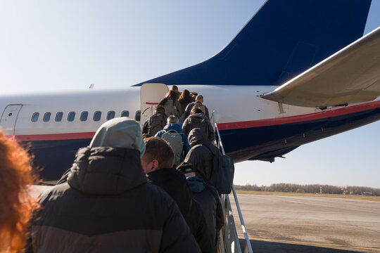 Boarding a Flight at the Airport on a Clear Day