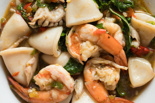 Close-Up of Homemade Pad Krapow (Thai Holy Basil Stir-Fry) with Shrimp and Squid, a Spicy and Appetizing Thai Seafood Dish