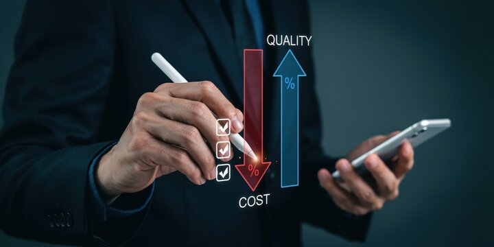 Businessman holding smartphone and pen pointing at cost reduction and quality improvement graph.