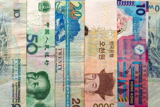 Vertical arrangement of Asian banknotes close-up