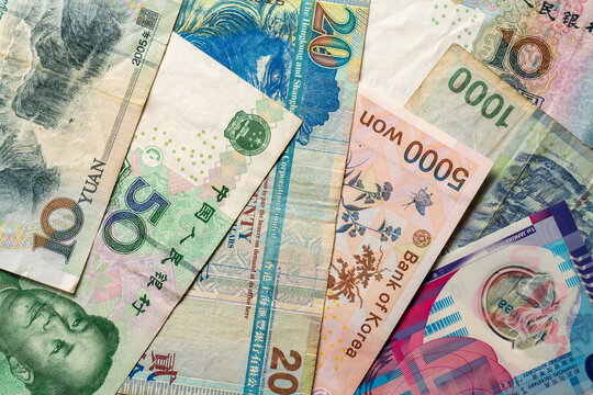 Assorted Asian and international banknotes close-up