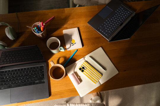 Workspace Setup With Laptops and Coffee 