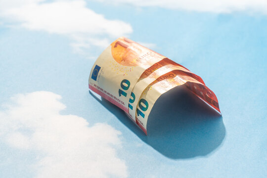 Arched ten euro banknote on blue sky background