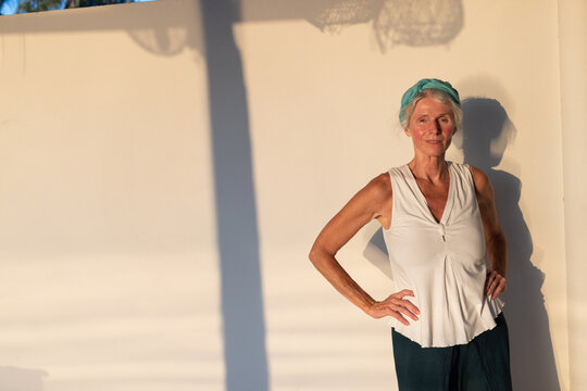 Confident Senior Woman portrait in Warm Sunset Light with Copy Space