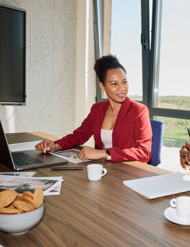 Businesswoman speaks with her colleague at the office