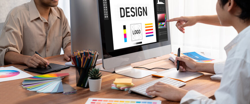 Graphic designer software for modern design of web page and commercial brisk ads showing on the computer screen