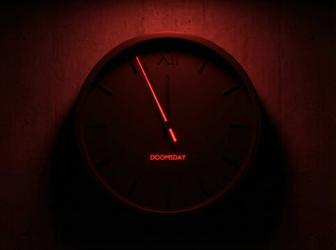 Red wall clock with minimalistic design displaying the word DOOMSDAY against a dark background. For concepts of fear, nuclear threat awareness, rising global tension, international conflict