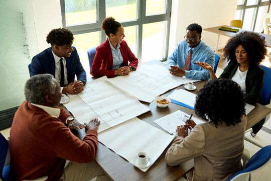 The board of architects is sitting in the meeting room