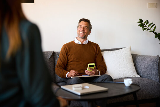 Colleagues talk business in a cozy workspace
