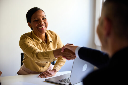 Woman greets her corporate partner