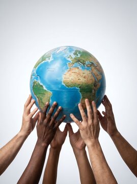 Hands holding a world globe against a white background representing global unity and environmental awareness