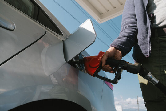 Anonymous man filling the gas tank