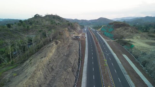 Stunning aerial view of Jl Bypass BIL Mandalika road during sunset in Lombok