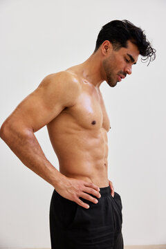 Man stands in profile, focusing on fitness and health goals indo