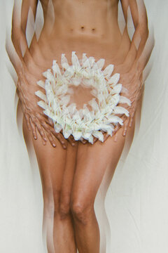 Abstract of nude female body with flower
