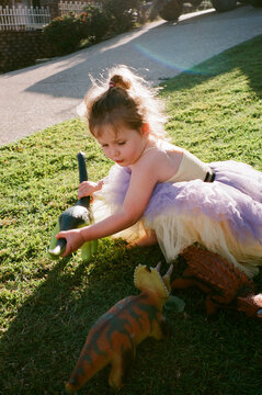 Young girl playing in Australian Front Yard on Film