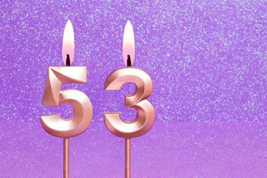 Number 53 on a pink background with blurred bright dots - Birthday or anniversary card with abstract blurred dots that glow