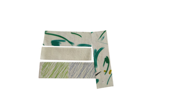 Folded money bills with green and blue design