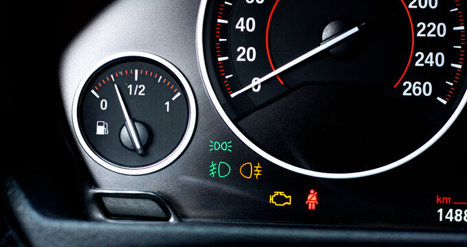 Car Dashboard Background with Engine Warning Light, Headlight Indicator, Speedometer and Fuel Gauge