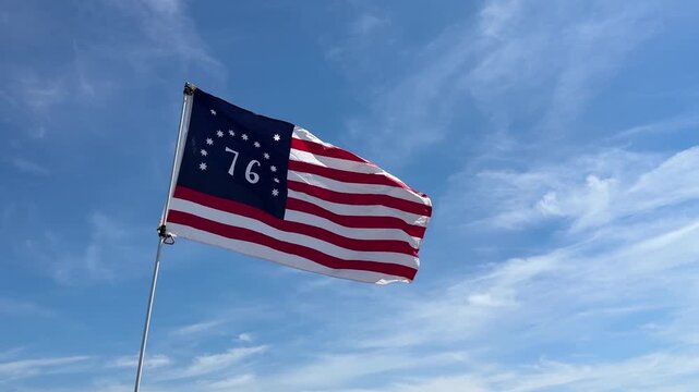 Bennington flag with "76" and 13 stars and stripes waving in the wind on a sunny day in Wildwood, New Jersey