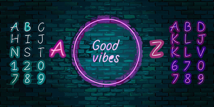 Neon sign typography with the phrase good vibes on a brick wall
