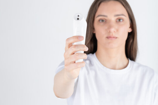 Woman holding a square picture frame creating a self-similar droste effect