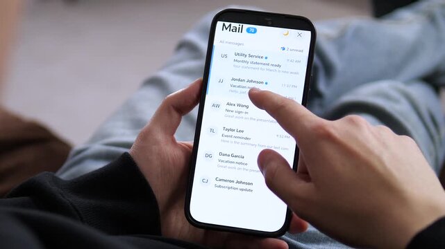 Browsing a mobile email inbox on a smartphone. The screen displays unread messages, utility statements, and work updates. Perfect for productivity apps, corporate communication, and digital workspace