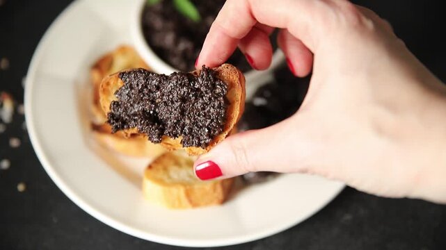 Tapenade black olives olive spread ready to eat tasty snack fresh and delicious gourmet food background rustic food on the table top view copy space