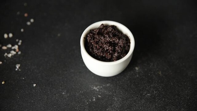 Tapenade black olives olive spread ready to eat tasty snack fresh and delicious gourmet food background rustic food on the table top view copy space