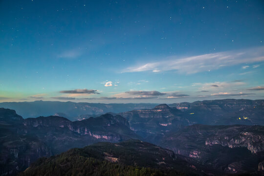 Starry night sky over mountains in a valley, in Mexiquillo, Sierra Madre Occidental of Durango