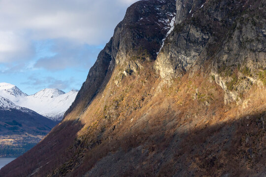 A beautiful spring landscape in a mountai valley with snow and sun. A springtime scenery in Geiranger Unesco World heritage area, Sunnmore, More og Romsdale, Norway.
