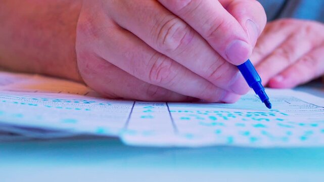 Cinematic macro of writing on a document.Defocused background, soft daylight. Visualizes studying, taking notes, tax filling, office routine, bureaucracy and paperwork .
