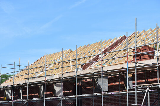 New homes under construction roof timbers beaning put in place  