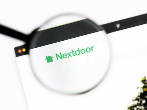 Milan, Italy 2026, 20 Apr Closeup of nextdoor website on a laptop screen. nextdoor logo under a magnifying glass.