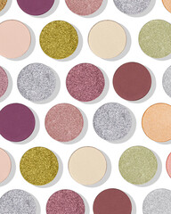 Fototapeta premium Shiny bright eyeshadow swatches with matte and shimmering texture with shadows as minimal trend beauty pattern on white. Modern facial cosmetic flat lay colorful makeup textures, top view background.