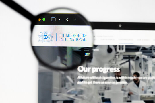 Milan, Italy 2026, 20 Apr Closeup of Philip Morris International website on a laptop screen. Philip Morris International logo under a magnifying glass.