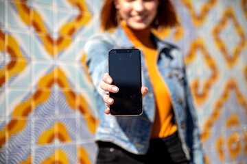 Fototapeta premium Smartphone focus with vibrant background.