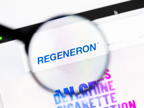 Milan, Italy 2026, 20 Apr Closeup of Regeneron Pharmaceuticals website on a laptop screen. Regeneron Pharmaceuticals logo under a magnifying glass.