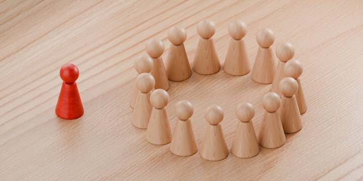 3d pawn figurines in a group, with one isolated, social exclusion, ostracise, group of people ostracising another person on their own, social outcast
