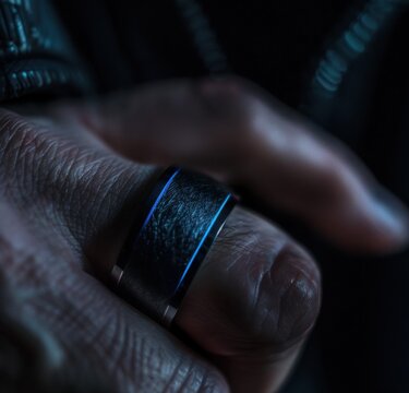 Macro shot of matte black smartwater ring with glowing blue line Canon EOS R5 100mm