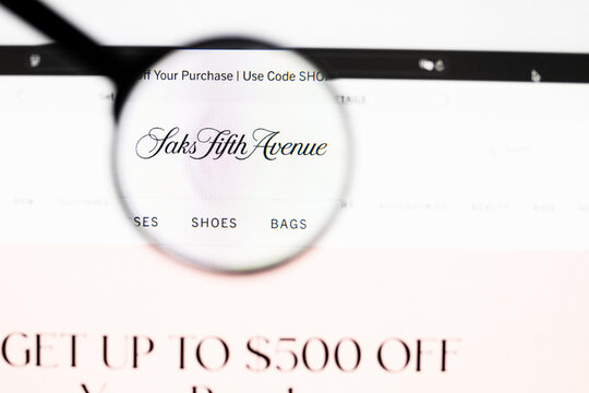Milan, Italy 2026, 20 Apr Closeup of Saks Fifth Avenue website on a laptop screen. Saks Fifth Avenue logo under a magnifying glass.