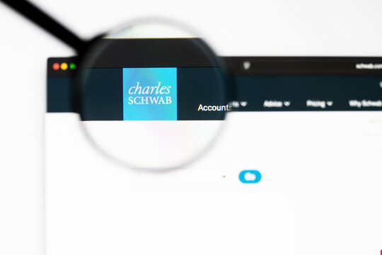Milan, Italy 2026, 20 Apr Closeup of schwab website on a laptop screen. schwab logo under a magnifying glass.