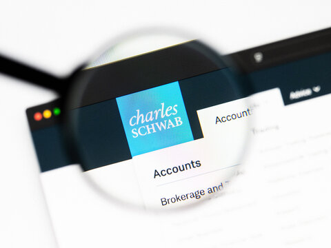 Milan, Italy 2026, 20 Apr Closeup of schwab website on a laptop screen. schwab logo under a magnifying glass.