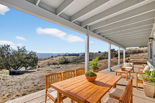 Covered patio dining with wooden table